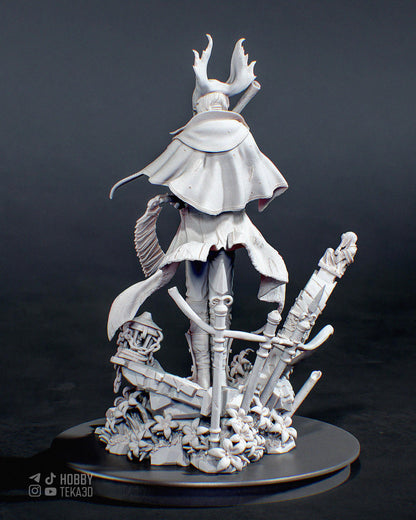 Rear view of an unpainted fantasy hunter resin figure with flowing cape and detailed ruined base